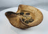 Ancient Punic-Roman terracotta oil lamp displaying folded rim construction and bronze coins