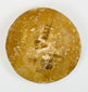 Handheld ancient seal with circular form and symbolic design