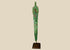 Ancient Bronze Age blade from the Caspian region, circa 2000–1000 BCE, with tapered elongated form, two perforations near the hilt, and rich green patina, mounted on a custom stand.