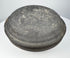 Ancient Chinese gray pottery covered box viewed from above, highlighting the broad domed cover and dark aged surface.
