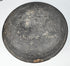 Exterior of an ancient Chinese Tang Dynasty pottery lid with charcoal-gray surface, wear, deposits, and concentric forming marks.