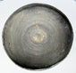 Interior of an ancient Chinese gray earthenware covered bowl showing visible concentric wheel-turning marks and lighter clay deposits.