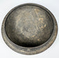 Interior view of the fitted gray pottery cover with rounded concave form, aged surface wear, and earthen accretions.