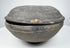 Ancient Tang Dynasty Chinese pottery covered bowl from an alternate angle, showing the lenticular profile and closely fitted two-part form.
