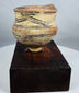 Ancient Majiayao-style painted pottery jar displaying geometric black designs