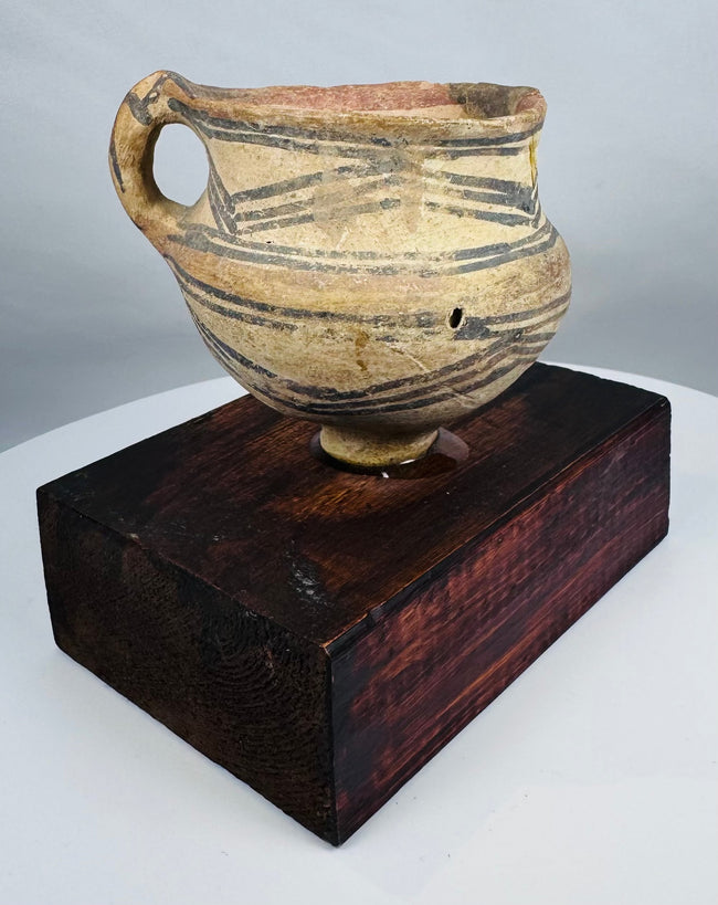 Chinese Neolithic pottery vessel with ring foot and painted triangular motifs