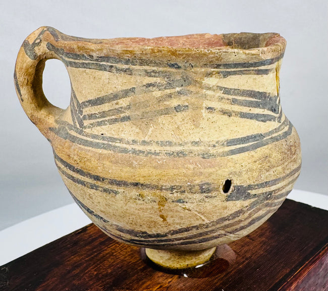 Neolithic painted pottery jar with single strap handle and archaeological patina