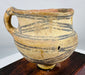 Neolithic painted pottery jar with single strap handle and archaeological patina