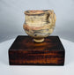 Neolithic Chinese terracotta pottery vessel with painted mineral pigments and strap handle