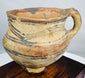 Majiayao cultural style pottery vessel with painted abstract patterns and aged surface