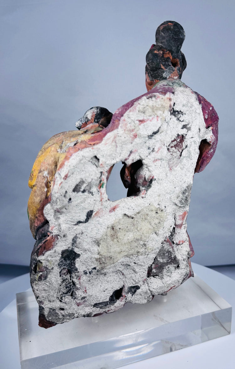 Angled rear view of Chinese sculptural fragment with cavities and irregular architectural backing