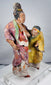 Chinese filial piety scene with deeply modeled figures, layered robes, and surviving pigments
