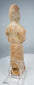 Side view of Tang tomb figure showing tall coiffure and vertical restoration crack