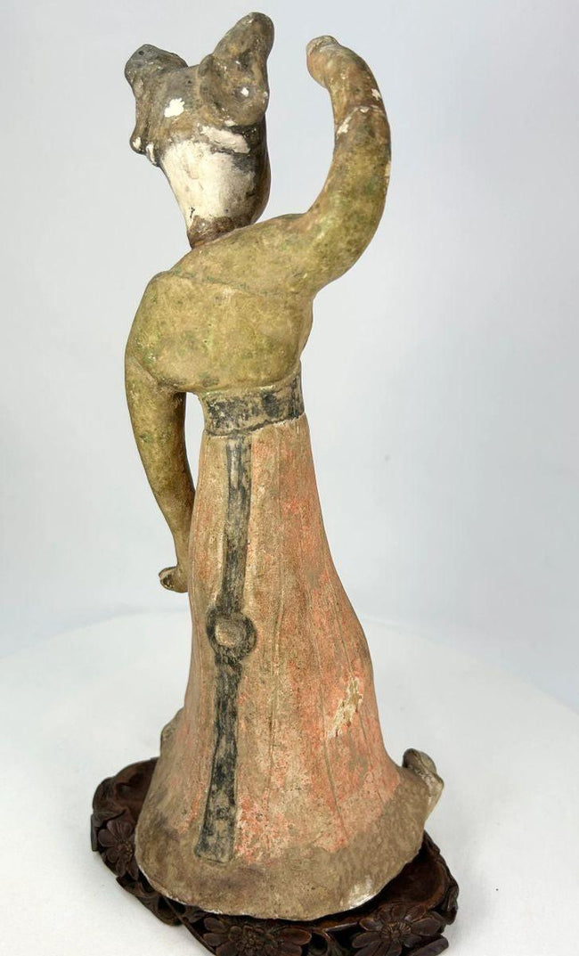 Chinese Tang Dynasty terracotta dancer mounted on later wooden base, with burial patina