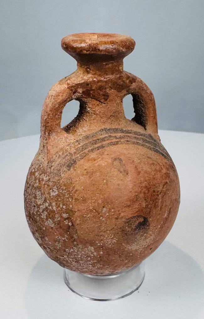 Front view of miniature Cypriot terracotta flask with everted rim and loop handles