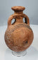 Front view of miniature Cypriot terracotta flask with everted rim and loop handles
