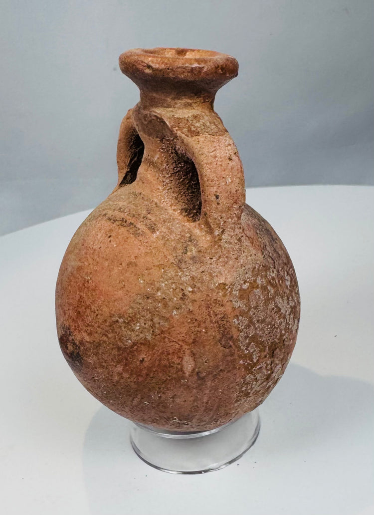Ancient Eastern Mediterranean handled flask with mineral accretions and surface wear