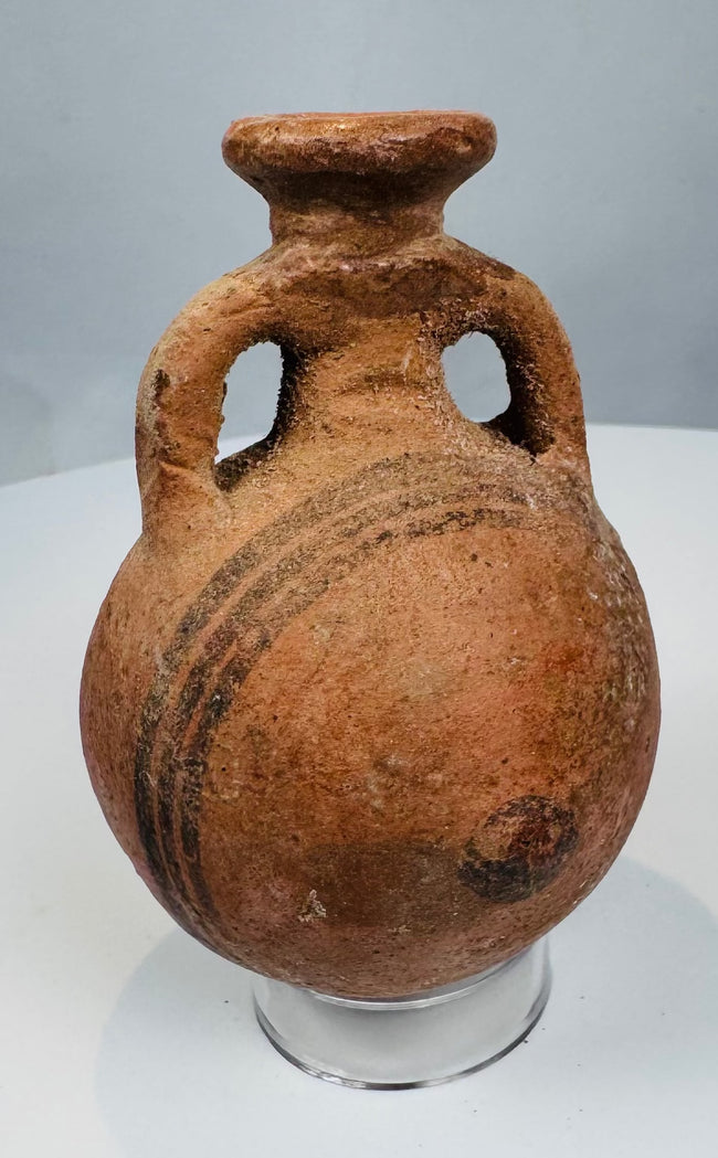 Cypro-Archaic Black-on-Red vessel with painted shoulder bands and archaeological patina