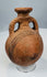 Cypro-Archaic Black-on-Red vessel with painted shoulder bands and archaeological patina