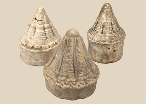 Three Eastern Indian Buddhist terracotta votive stupas with tiered conical forms, circa 8th–12th century CE