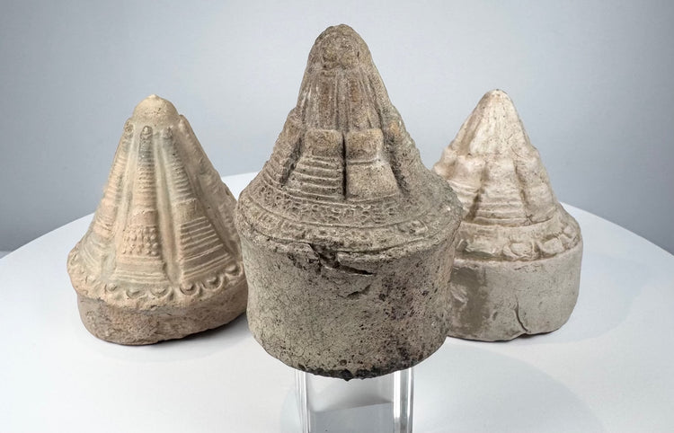 Ancient Indian votive stupas with moulded lotus-petal decoration and weathered archaeological surfaces