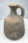 Ancient Levantine single-handled vessel in coarse grey-fired clay
