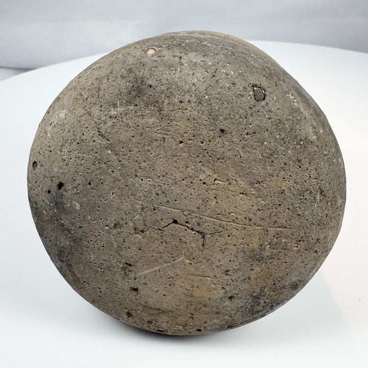 Archaeological pottery jug with thick walls, flared mouth, and aged surface patina