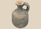 Ancient Iron Age grey earthenware jug with rounded body and loop handle