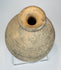 Small Roman Byzantine pottery bottle displayed on a clear acrylic stand