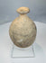 Front view of buff-coloured Roman Byzantine bottle with thickened rim