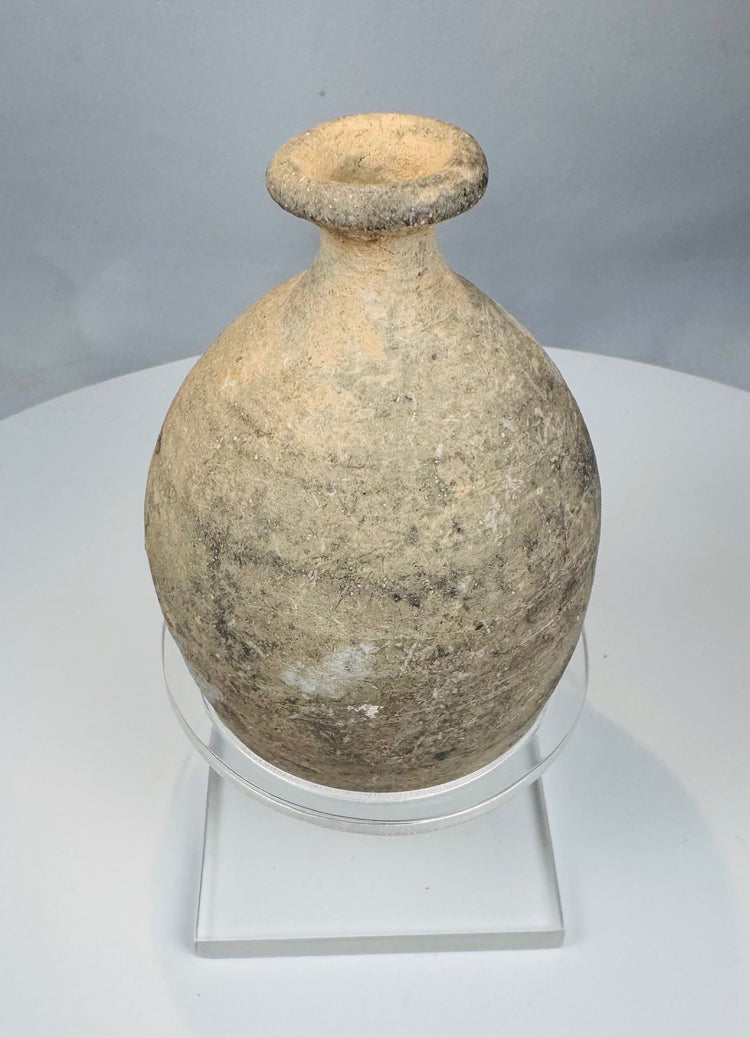 Front view of buff-coloured Roman Byzantine bottle with thickened rim