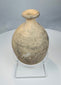 Front view of buff-coloured Roman Byzantine bottle with thickened rim