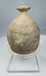 Close-up of everted rim and narrow opening on an ancient terracotta bottle