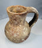 Eastern Mediterranean pottery pitcher with tall neck, pinched spout, and burial deposits