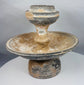 Museum-quality terracotta ritual vessel with pedestal base and architectural form