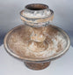 Terracotta ritual stand with mineral deposits and surviving painted decoration