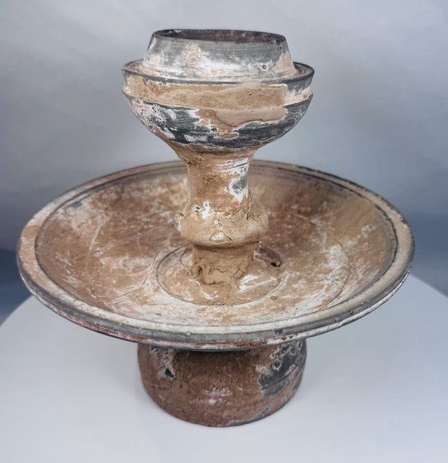 Near Eastern terracotta pedestal lamp or offering vessel with aged encrustation