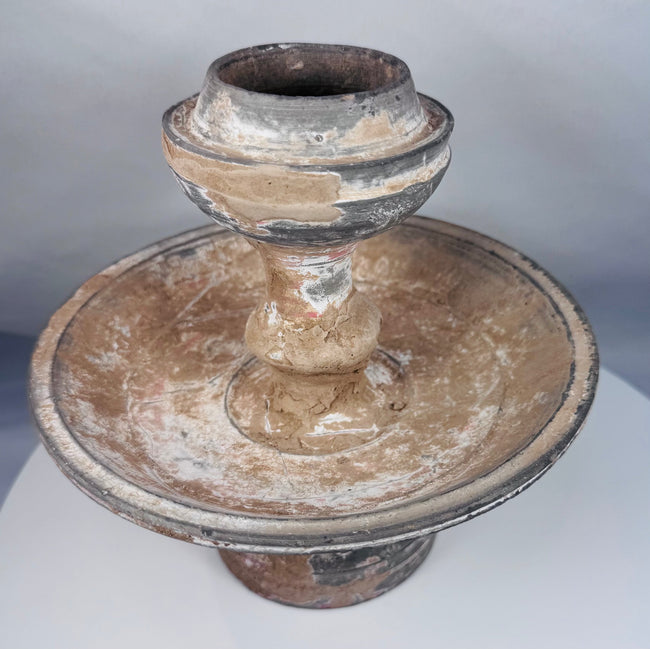 Rare ancient ceremonial pottery stand displaying centuries of burial deposits