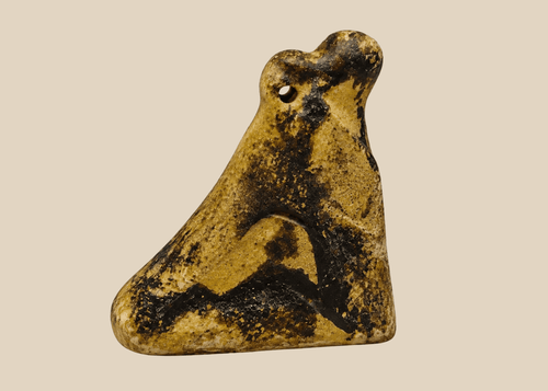 Ancient Egyptian carved stone falcon amulet associated with the god Horus from the Late Period.