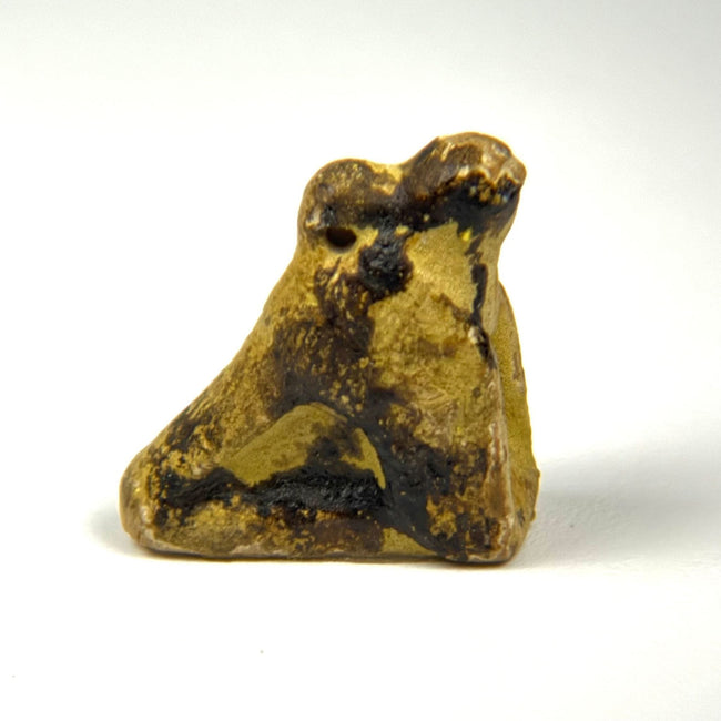 Ancient Egyptian carved stone Horus bird amulet, crouching falcon with folded wings