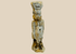 Ancient Egyptian faience amulet figure with heavy burial patina shown upright.