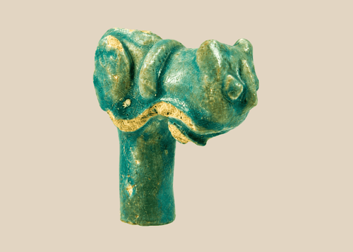 Ancient Egyptian faience vessel handle fragment with stylized cat head representing Bastet, Late Period.