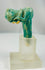 Egyptian faience artifact fragment showing feline head from ritual vessel handle.