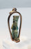 Late Period Egyptian faience amulet depicting a stylized standing divine figure
