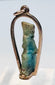 Front view of an ancient Egyptian divine figure amulet mounted as gold jewelry