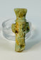 Small Egyptian green faience Bes amulet worn as a protective charm in antiquity.