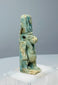 Reverse view of a Late Period Egyptian Taweret amulet showing deep blue glaze remnants