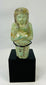 Late Period Egyptian funerary ushabti with crossed arms and agricultural implements