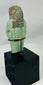 Ancient ushabti figure from Egypt with black painted basket grid and hieroglyphs