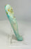 Right side of turquoise-glazed faience ushabti showing ancient surface wear and burial patina.